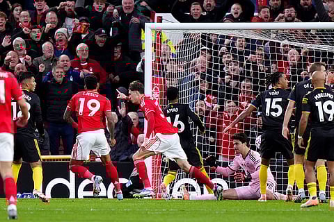 Nottingham Forest's Nicolo Savona, center, celebrates scoring during the English Premier League match between Nottingham Forest and Manchester United in Nottingham, England.