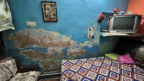 Families in Tilak Vihar continue to live in crumbling homes.