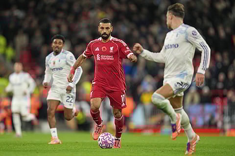 Liverpool's Mohamed Salah, centre, in action during the English Premier League soccer match between Liverpool and Aston Villa in Liverpool, England.
