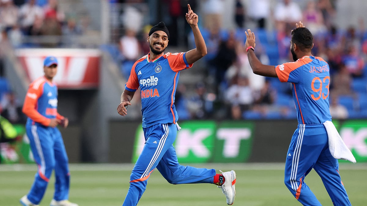 Arshdeep Singh celebrates with Jasprit Bumrah (Right) - null