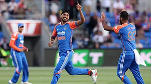 Arshdeep Singh celebrates with Jasprit Bumrah (Right)