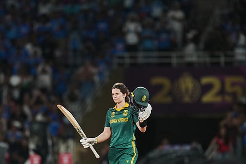 South Africa's captain Laura Wolvaardt celebrates her century during the ICC Women's Cricket World Cup final match between India and South Africa in Navi Mumbai.