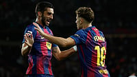 AP/Joan Monfort : Barcelona's Ferran Torres, right, celebrates with his teammate Fermin Lopez after scoring his side's second goal during a Spanish La Liga soccer match
