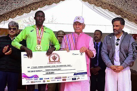 Jammu and Kashmir Lt. Governor Manoj Sinha felicitates the winner of 2nd Kashmir Marathon 2025, in Srinagar. 