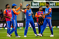 | Photo: Linda Higginson/AAP Image via AP : India players celebrate a wicket during the T20 cricket international between India and Australia in Hobart.