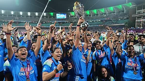 AP Photo/Rafiq Maqbool : India's players with the winning trophy after their win over South Africa in the ICC Women's Cricket World Cup final match in Navi Mumbai, India, Monday, Nov. 3, 2025