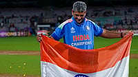 Amol Muzumdar's Factfile: The Mastermind Behind India Women’s Historic World Cup Triumph | Photo: PTI/Kunal Patil : India’s coach Amol Muzumdar plants the Indian tricolour on the pitch after the team won the ICC Women's World Cup 2025, at the DY Patil Stadium, in Navi Mumbai.