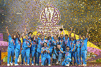 | Photo: AP/Rafiq Maqbool : India's players pose with the winning trophy after their win over South Africa in the ICC Women's Cricket World Cup final match in Navi Mumbai.