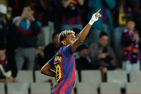 Barcelona's Lamine Yamal celebrates after scoring his side's opening goal during a Spanish La Liga soccer match between FC Barcelona and Elche CF in Barcelona, Spain.