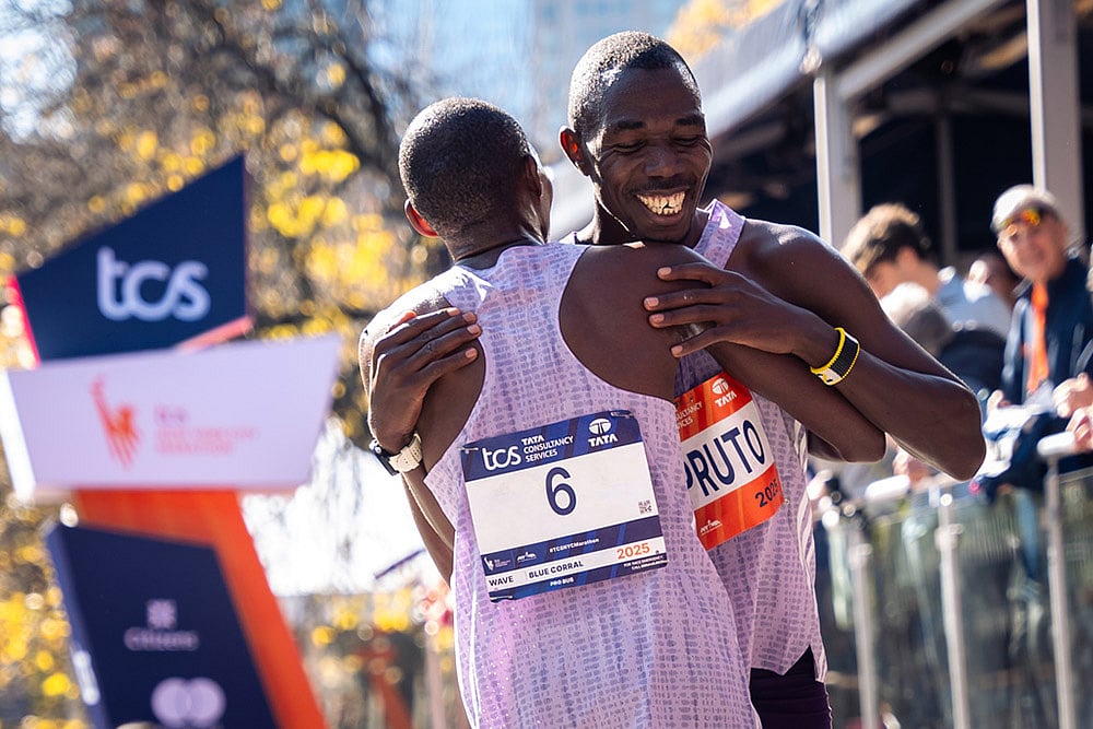 | Photo: AP/Angelina Katsanis : Benson Kipruto and Alexander Mutiso and hug and laugh with each other after a close finish crossing the finish line to win first and second place in the men's elite division of the New York City Marathon in New York. 