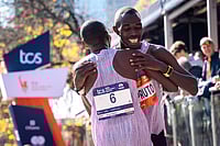| Photo: AP/Angelina Katsanis : Benson Kipruto and Alexander Mutiso and hug and laugh with each other after a close finish crossing the finish line to win first and second place in the men's elite division of the New York City Marathon in New York. 