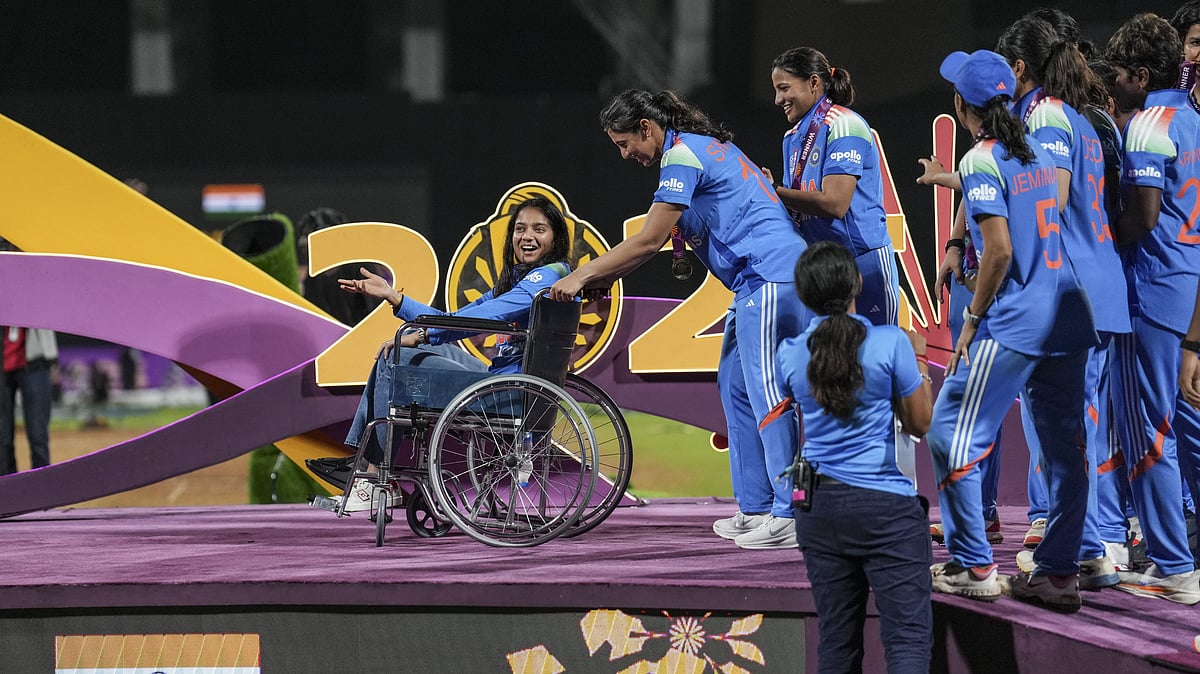 Smriti Mandhana brings teammate Pratika Rawal on a wheelchair as the Indian team receives winning medals during the presentation ceremony of the ICC Women's World Cup 2025, at the DY Patil Stadium in Navi Mumbai. - PTI