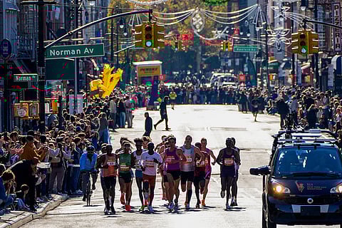Athletes in the men's elite division make their way through Brooklyn during the New York City Marathon in New York.