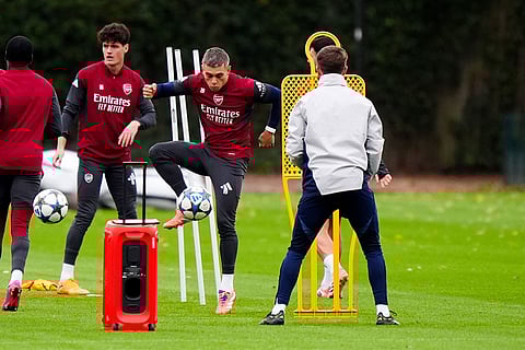 Arsenal's Leandro Trossard plays the ball during a training session in London, England.