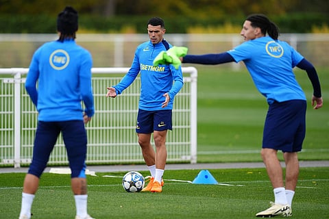 Tottenham Hotspur's Pedro Porro, center, during a training session in London, England.