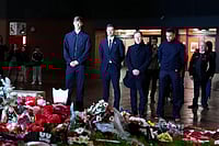 | Photo: Peter Byrne/PA via AP : From left: Real Madrid's Dean Huijsen, head coach Xabi Alonso, head of public relations Emilio Butragueno and Trent Alexander-Arnold pay their respects next to the Diogo Jota memorial outside Anfield, Liverpool, England, ahead of the Champions League soccer match against Liverpool.