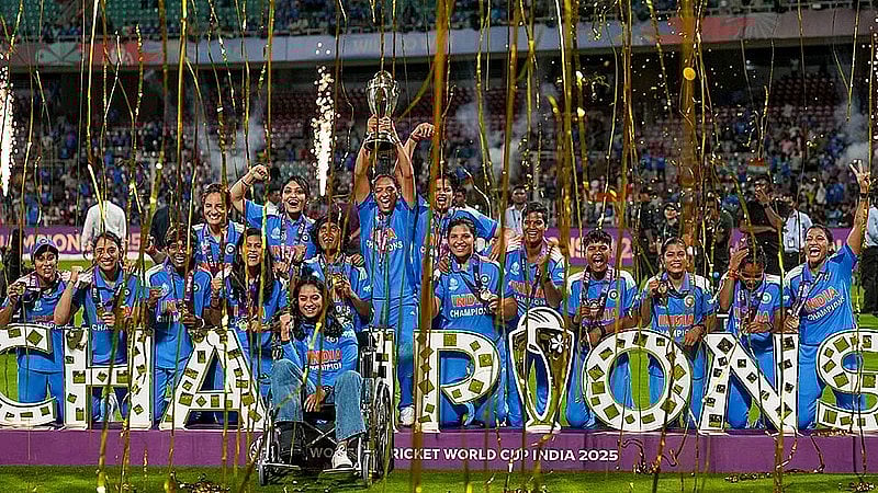 PTI : India’s players celebrate with the trophy after winning the ICC Women's World Cup 2025, at the DY Patil Stadium in Navi Mumbai.