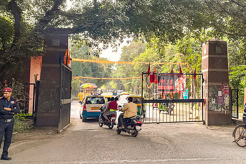 A security guard stands at the entrance to the Jawaharlal Nehru University (JNU) on the day of JNU Students' Union (JNUSU) elections, in New Delhi.