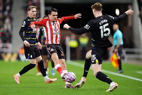 Sunderland's Enzo Le Fee and Everton's Jake O'Brien, right, during the English Premier League soccer match between Sunderland and Everton in Sunderland, England.
