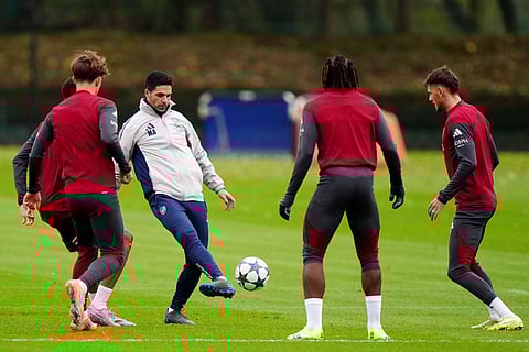 Arsenal manager Mikel Arteta plays the ball during a training session in London, England.