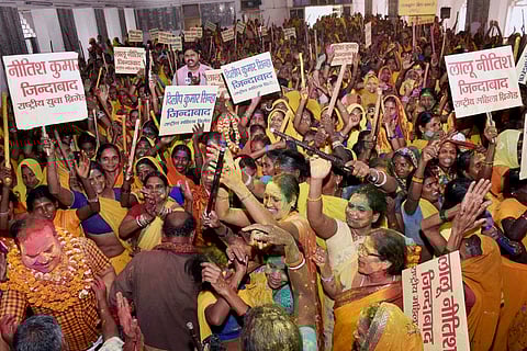 Mahila Brigade activists celebrate after Bihar government bans country made liquor in Patna