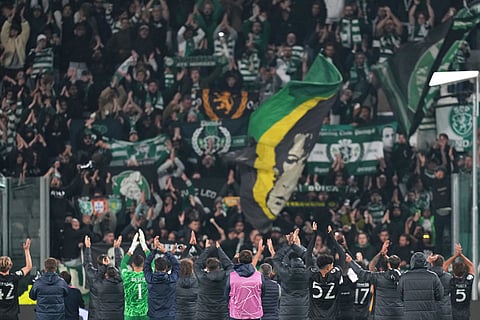 Sporting players applaud their supporters at the end of the Champions League opening phase soccer match between Juventus and Sporting CP in Turin, Italy.