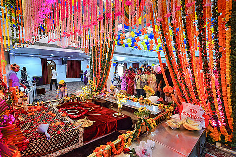 Devotees offer prayers at Gurudwara Shri Guru Singh Sabha on the occasion of Guru Nanak Jayanti festival, in Jaipur.
