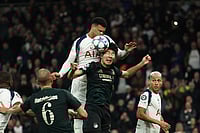 | Photo: AP/Ian Walton : Tottenham's Dane Scarlett, top, duels for the ball with Copenhagen's Junnosuke Suzuki during the Champions League opening phase soccer match between Tottenham and Copenhagen, in London, England.