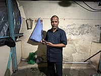 Photo - Priyanka Tupe.   : Gangaprasad Singh, migrant from Bihar's Darbhanga works as a security guard, live in this 70 sq feet cabin. Deepak Darbhangias maithili bhajans help him survive alianation from ballot battle on melancholic nights. 