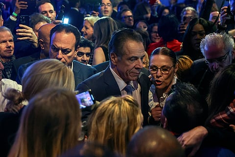 Andrew Cuomo talks with supporters after conceding the mayoral election to Zohran Mamdani in New York. 