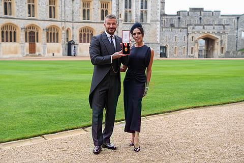 Sir David Beckham, with his wife Victoria, after he was made a Knight Bachelor at an investiture ceremony at Windsor Castle, Windsor, England.

