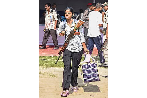 Security personnel leave for their allotted duty locations on the eve of the first phase of the Bihar Assembly elections, in Patna.
