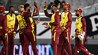 | Photo: AP/Andrew Cornaga                                           : West Indies bowler Romario Shepherd is congratulated by teammates after taking the wicket of New Zealand's Tim Robinson during the T20I match in Auckland, New Zealand, Wednesday, November 5, 2025. 
