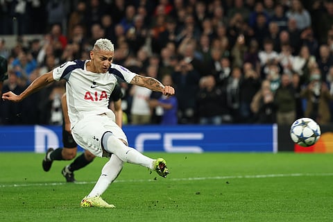 Tottenham's Richarlison misses to score the penalty during the Champions League opening phase soccer match between Tottenham and Copenhagen, in London, England.