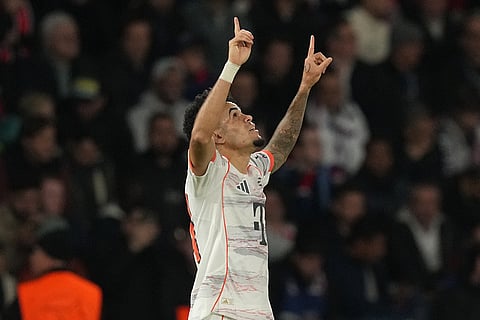 Bayern's Luis Diaz celebrates after scoring his side's second goal during the Champions League opening phase soccer match between Paris Saint-Germain and Bayern Munich in Paris, France.