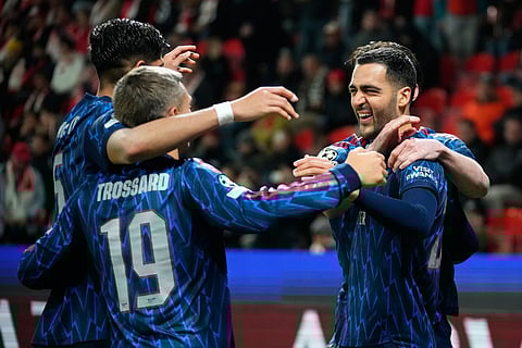 Arsenal's Mikel Merino, right, celebrates with his teammates after scoring his side's second goal during the Champions League opening phase soccer match between Slavia Prague and Arsenal in Prague, Czech Republic.