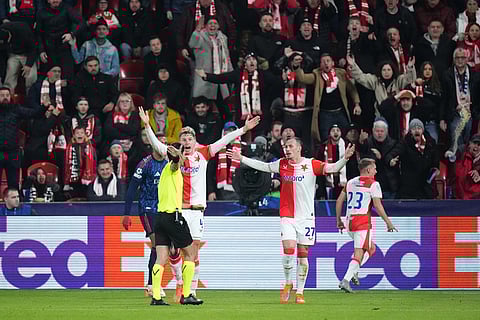 Slavia's Tomas Vlcek, right, and Slavia's David Zima remonstrate with referee Aliyar Aghayev during the Champions League opening phase soccer match between Slavia Prague and Arsenal in Prague, Czech Republic.
