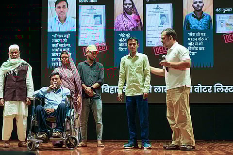 LoP in the Lok Sabha and Congress leader Rahul Gandhi with people from Haryana on the stage to share personal testimonies of alleged voter list manipulations during a press conference, in New Delhi.