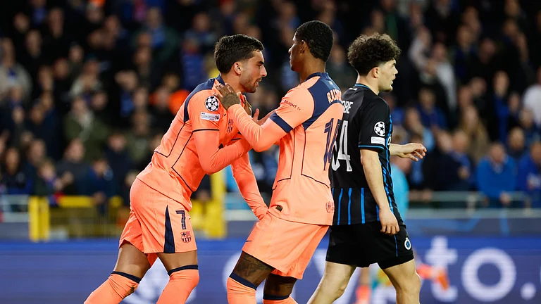 Barcelona's Ferran Torres, left, celebrates after scoring his sides first goal during the Champions League opening phase soccer match between Club Brugge and Barcelona in Bruges, Belgium, Wednesday, Nov. 5, 2025. - (AP Photo/Geert Vanden Wijngaert)