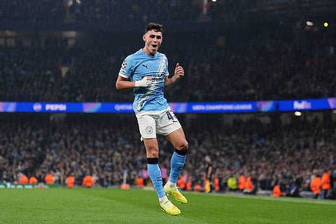 Manchester City's Phil Foden celebrates scoring their third goal during the Champions League opening phase match against Borussia Dortmund Manchester, England.