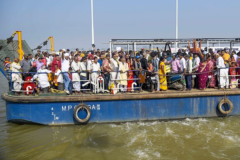 Bihar Phase 1 Polling-Voters onboard a ferry to cross the Ganga river