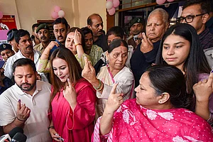 | Photo: PTI : RJD leader and Leader of Opposition in Bihar Assembly Tejashwi Yadav and his wife Rajshree Yadav, party leaders and former Bihar chief ministers Lalu Prasad Yadav and Rabri Devi, party MP Misa Bharti and others show their fingers marked with indelible ink after casting votes at a polling station during the first phase of Bihar Assembly elections, in Patna.