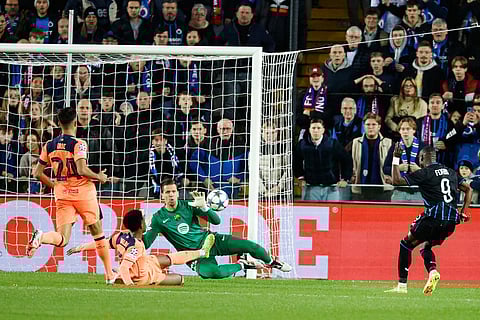 Brugge's Carlos Forbs, right, scores his sides second goal during the Champions League opening phase soccer match between Club Brugge and Barcelona in Bruges, Belgium.