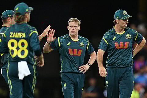 Australia's Nathan Ellis, centre, celebrates with teammates after dismissing Indian batsman Shivam Dube during a T20 cricket international between India and Australia in Carrara, Australia.