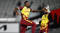 Photo: Andrew Cornaga/Photosport via AP : New Zealand Vs West Indies Live Score, 2nd T20I: Jayden Seales celebrates with teammate Shai Hope, right, after taking the wicket of Michael Bracewell in Auckland.
