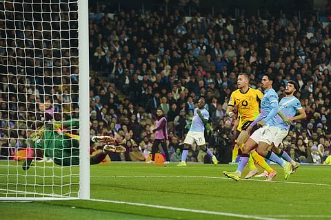 Dortmund's Waldemar Anton scores his side's opening goal during the Champions League opening phase soccer match between Manchester City and Borussia Dortmund in Manchester, England.