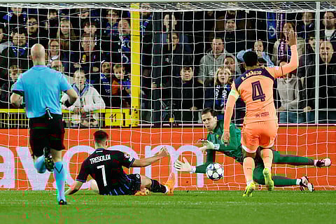 Brugge's Nicolo Tresoldi, second left, scores the opening goal during the Champions League opening phase soccer match between Club Brugge and Barcelona in Bruges, Belgium.