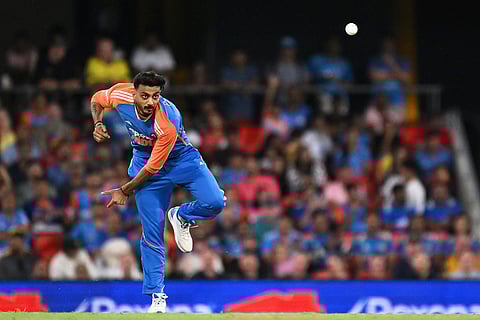 India's Axar Patel bowls during a T20 cricket international between India and Australia in Carrara, Australia.