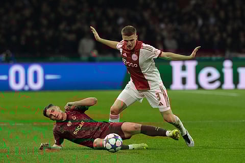 Ajax's Oscar Gloukh sends a cross in front of Galatasaray's Victor Osimhen during the Champions League between Ajax and Galatasaray in Amsterdam, Netherlands.