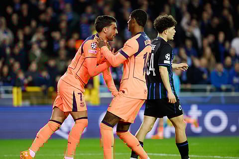 Barcelona's Ferran Torres, left, celebrates after scoring his sides first goal during the Champions League opening phase soccer match between Club Brugge and Barcelona in Bruges, Belgium.